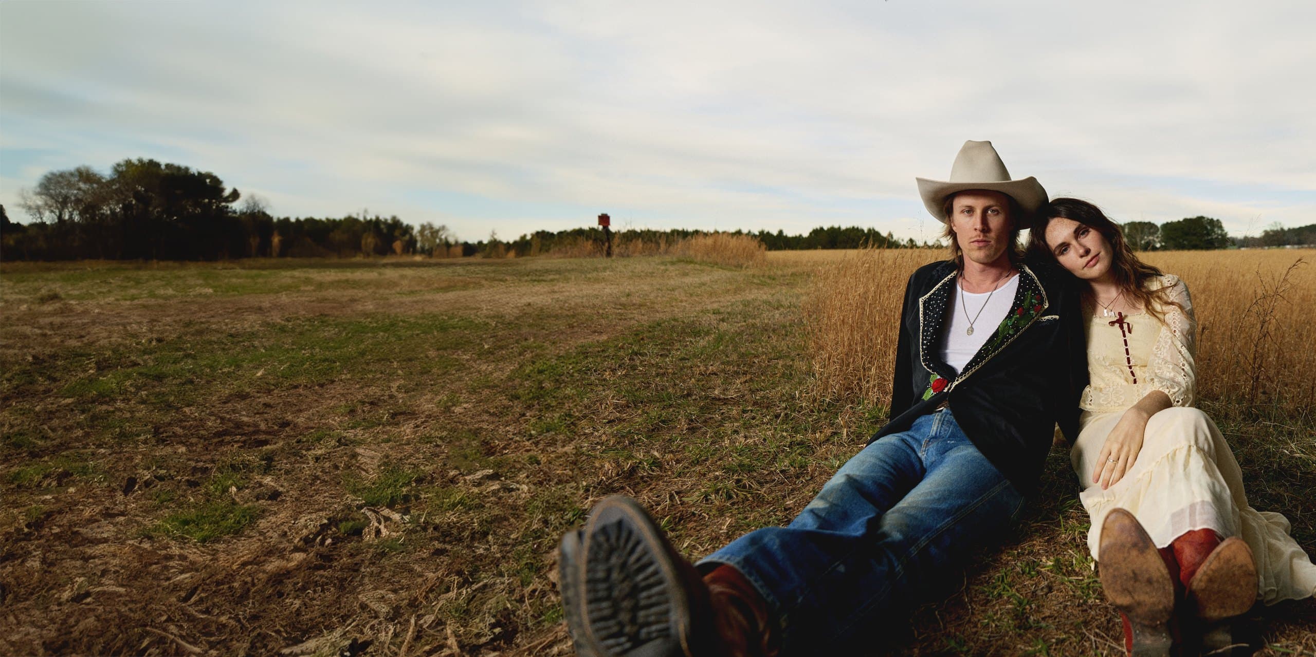 Little Hopes, Brock Shanks and Sydney Rhame, sitting in a field